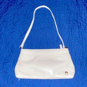White Shoulder Bag with Textured Material and Curved Shape